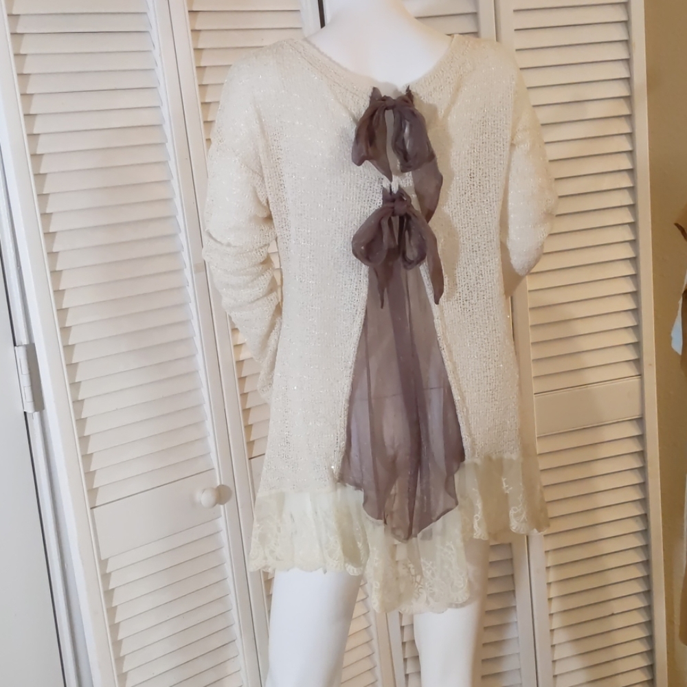 Subtle sparkle sweater with a surprise in back!